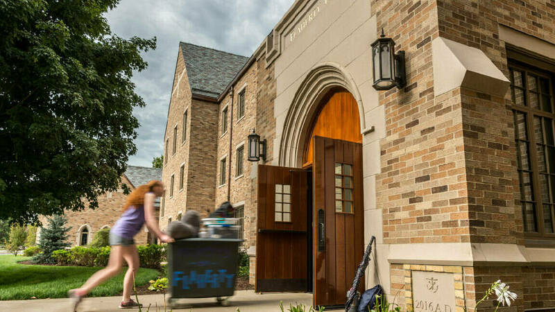 Student moving into Flaherty Hall