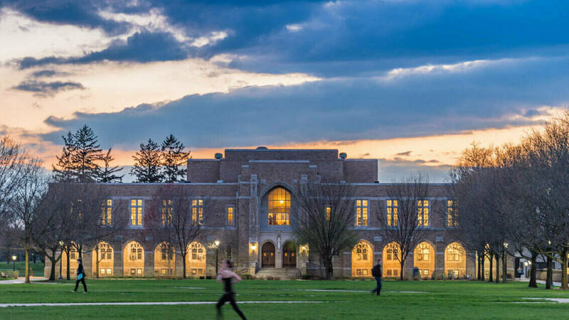 Student running on the South Quad outside the Rockne Memorial